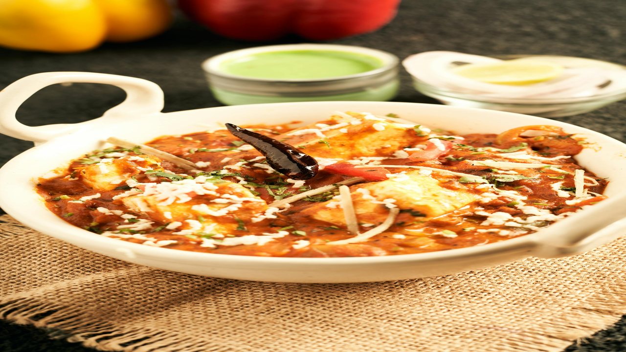 Paneer curry in kadhai with peppers and spices